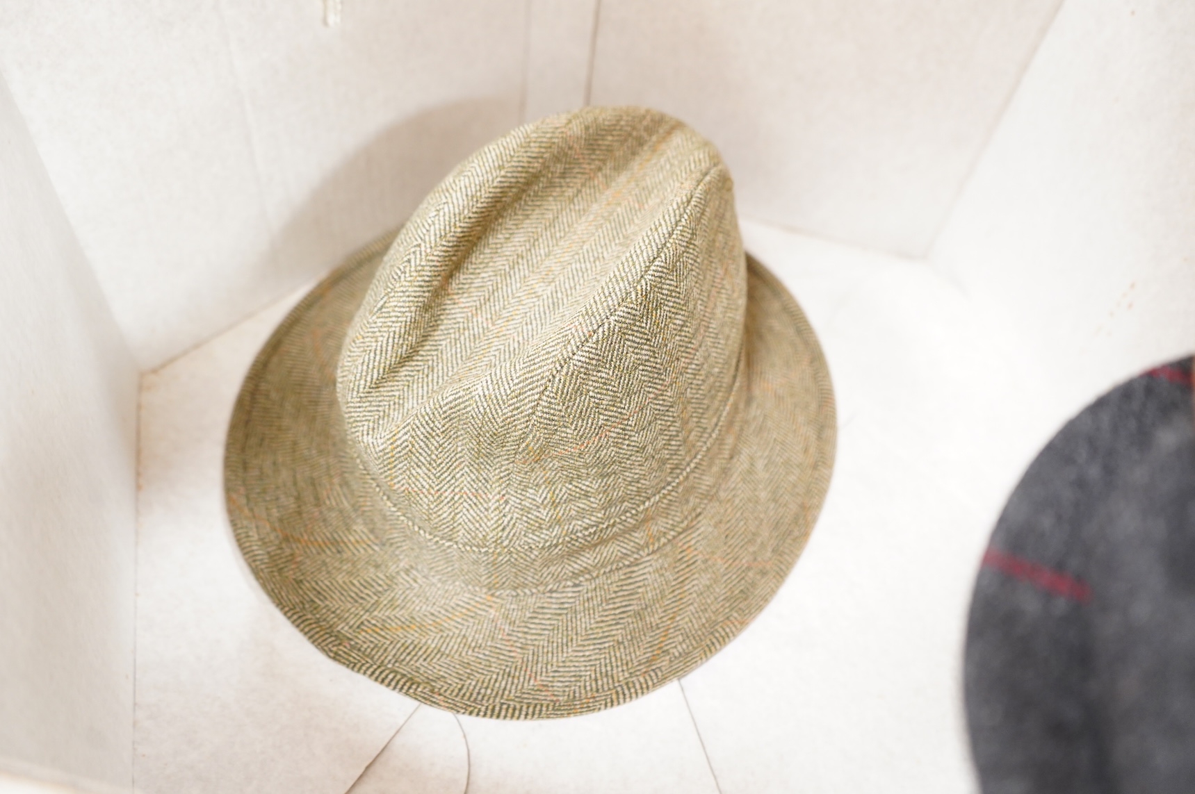 Two hat boxes containing five gentleman's hats; three Fedoras by Locke, Christy’s and Herbert Johnson and two straw Panamas, one by Bates.